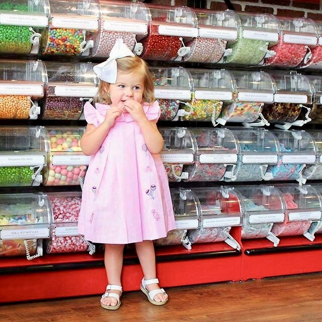 Child in front of candy wall