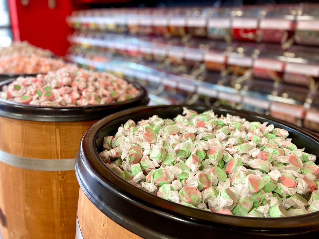 Store with bright red cabinets and shelves of candy